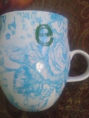 Anthropologie Homegrown Blue Floral Ceramic Mug with Green Letter Accent